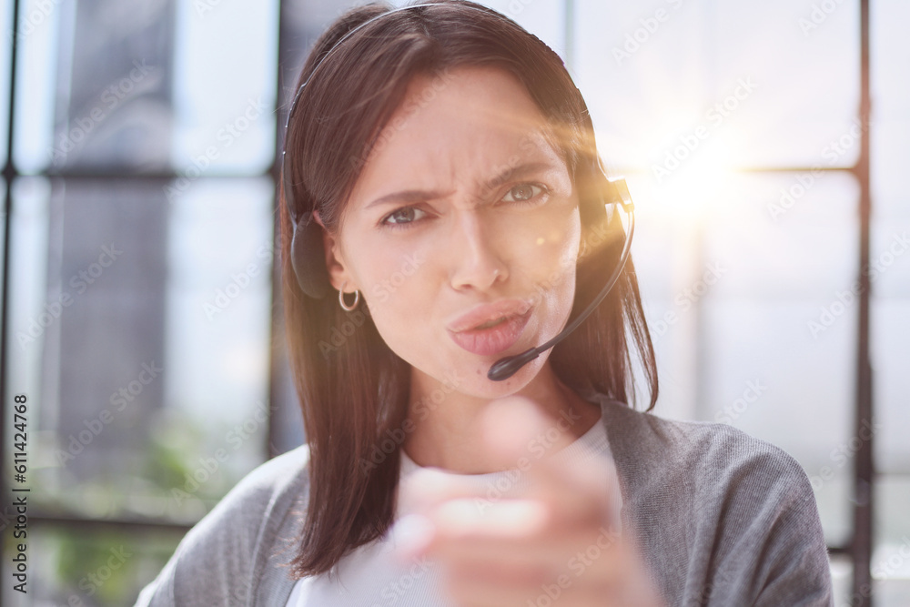 call center operator woman pointing with finger to the camera and to you, hand sign, positive and confident gesture from the front call center operator woman pointing with finger to the camera and to you, hand sign, positive and confident gesture from the front