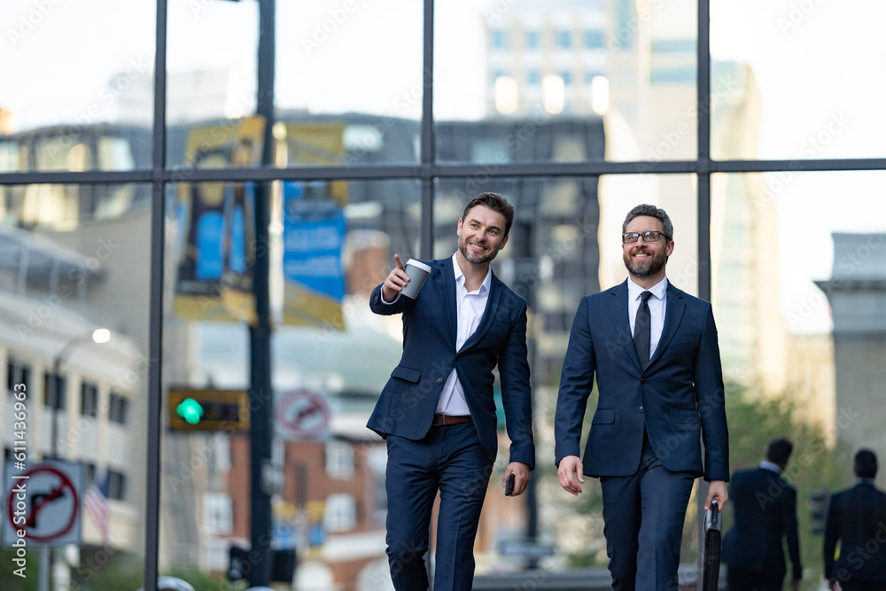 business partners negotiate at break in the street, pointing. business partners negotiate business partners negotiate at break in the street, pointing. business partners negotiate