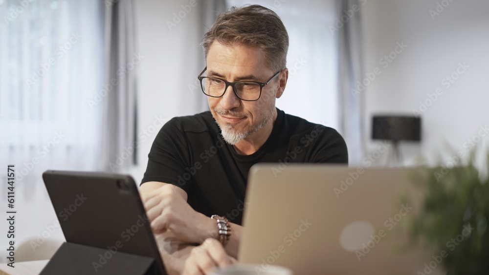 Man working with laptop in home office Man working with laptop in home office