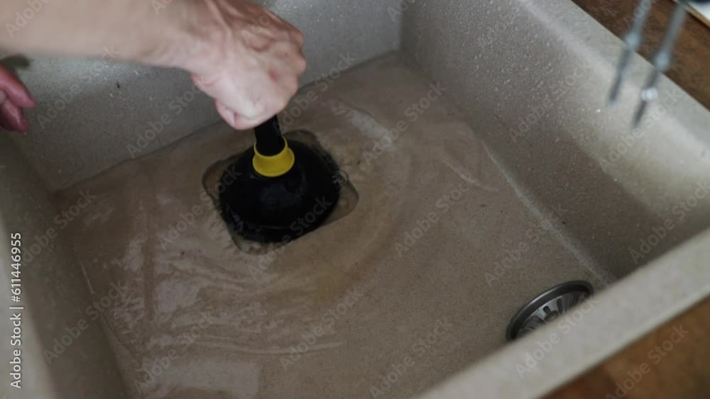 drain cleaning. using plunger sink to cleaning drain hole blockage