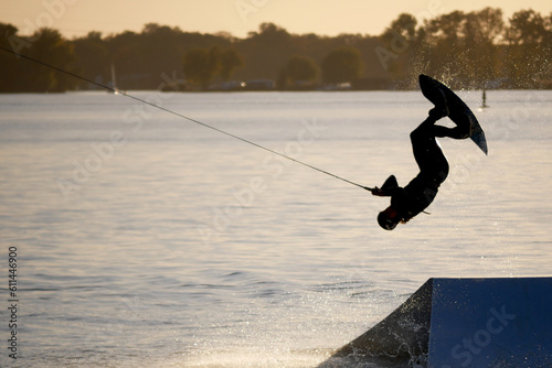 Photography wake boarding on a lake during a golden sunset