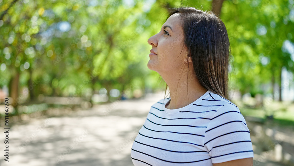 Middle eastern woman smiling confident looking up at park Middle eastern woman smiling confident looking up at park