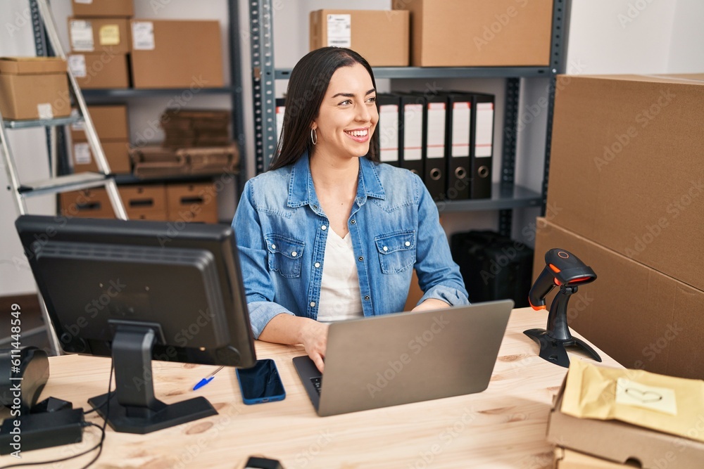 Young beautiful hispanic woman ecommerce business worker using laptop at office Young beautiful hispanic woman ecommerce business worker using laptop at office