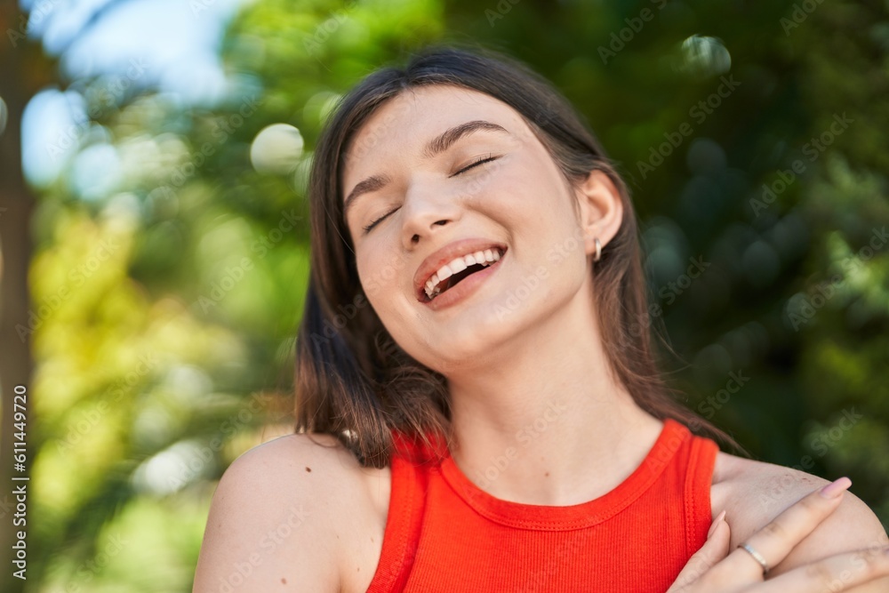 Young caucasian woman breathing with closed eyes at park Young caucasian woman breathing with closed eyes at park