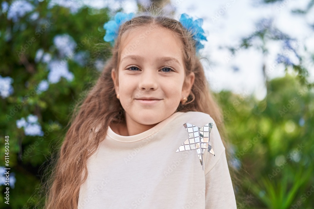 Adorable caucasian girl smiling confident standing at park Adorable caucasian girl smiling confident standing at park