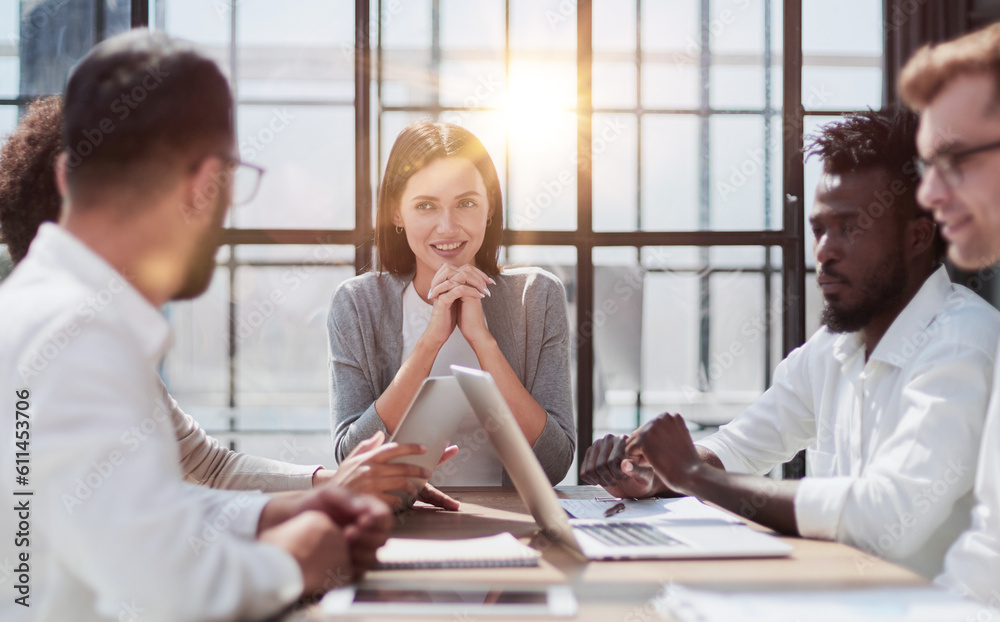 Fototapeta premium Employees working at computer together, discussing content