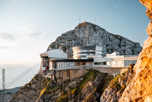 Pilatus mountain cable way station and hotel at the mountain top during sunrise. Beautiful panoramic views for tourists visiting Lucerne Switzerland. photo