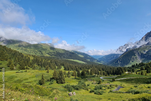 Mountain Landscape with fresh green vegetation and dramatic clouds