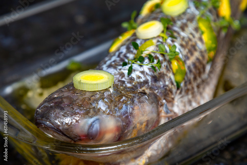 Traditional mullet fish ( Mugil cephalus, Chelon labrosus, Agonostomus monticola, Liza ramada or Mugil curema). Roasted tainha fish. photo