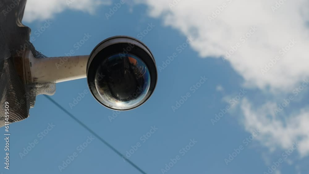 Daytime Surveillance: Establishing Shot of CCTV Security Camera on Building Wall Daytime Surveillance: Establishing Shot of CCTV Security Camera on Building Wall