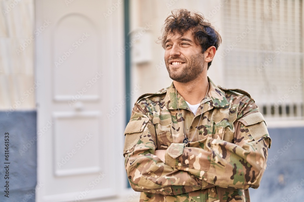Young man army soldier smiling confident standing with arms crossed gesture at street