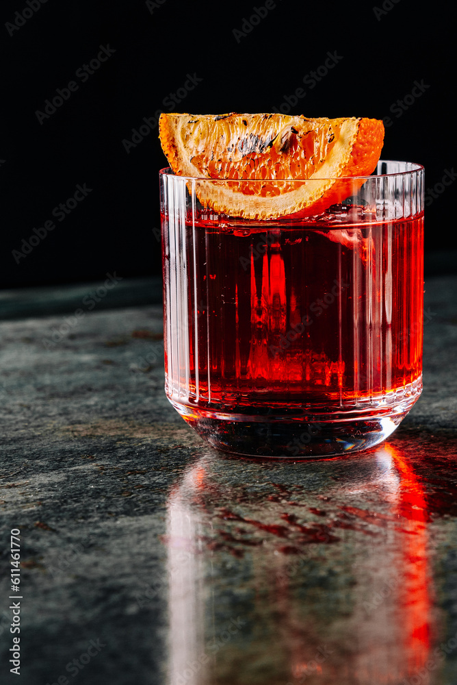 Cocktail Negroni with gin, campari martini rosso and orange. negroni