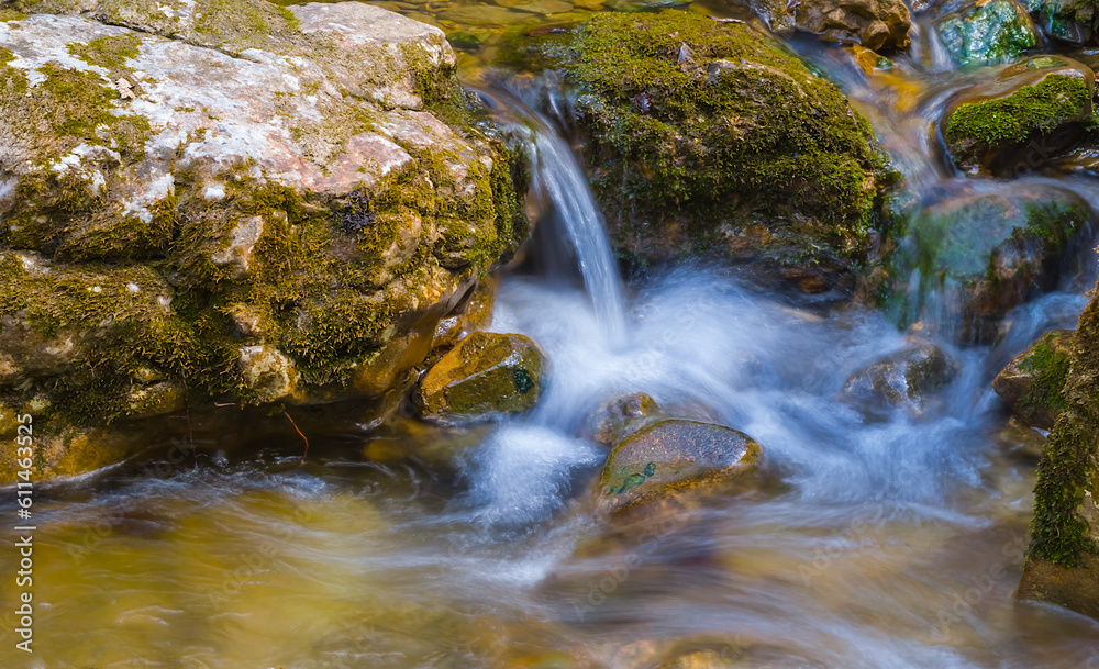 closeup small waterfall on the mountain river closeup small waterfall on the mountain river