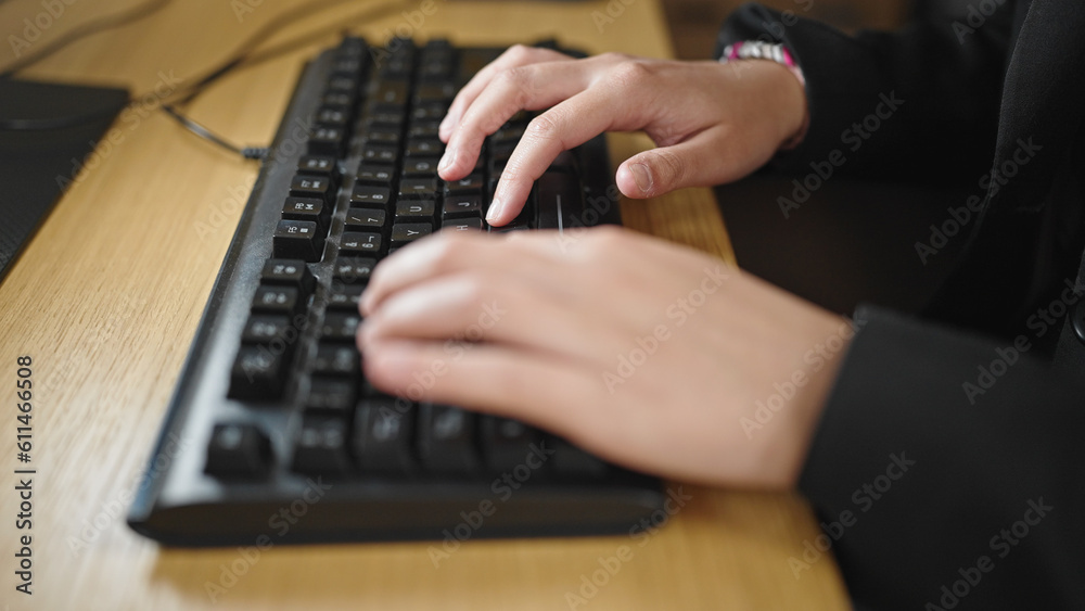 Young beautiful hispanic woman using computer typing on keyboard at office Young beautiful hispanic woman using computer typing on keyboard at office