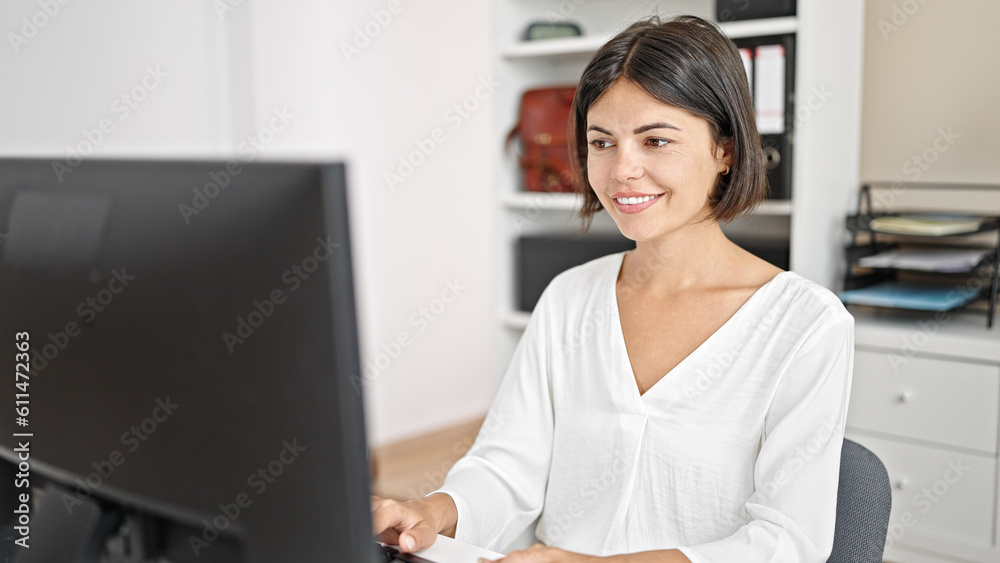 Young beautiful hispanic woman business worker using computer working at office Young beautiful hispanic woman business worker using computer working at office