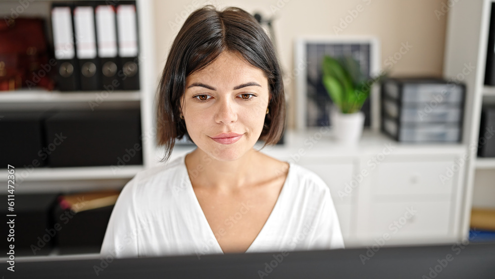 Young beautiful hispanic woman business worker using computer working at office Young beautiful hispanic woman business worker using computer working at office
