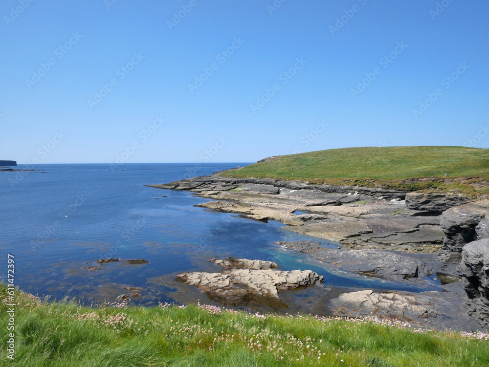 Cliffs and hills at the Atlantic ocean, rocks canyon, beauty in nature. Vacation travel to Ireland background Cliffs and hills at the Atlantic ocean, rocks canyon, beauty in nature. Vacation travel to Ireland background
