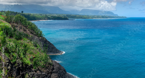View of the North Shore on the Island of Kauai, Hawaii. One of the most popular resort areas is located on the north shore of Kauai including Princeville. The Pacific Ocean is the star of this area. photo