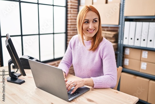 Young caucasian woman ecommerce business worker using laptop at office
