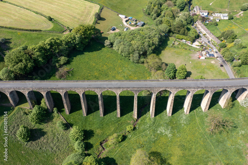 Aerial drone photo of the town of Thornton which is a village within the metropolitan borough of the City of Bradford, in West Yorkshire, England showing the village and viaduct in the summer time.