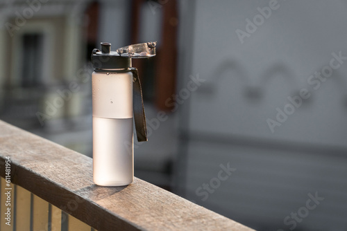 Plastic fitness water bottle with an open cap.