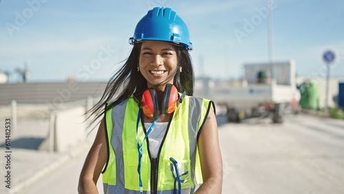 African american woman builder smiling confident standing at street