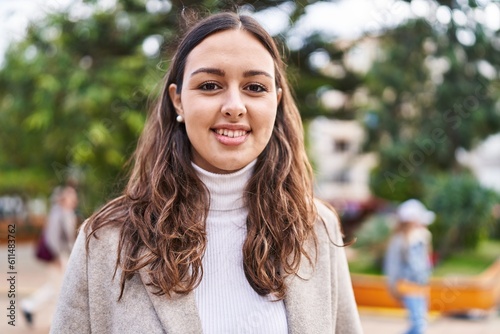 Young beautiful hispanic woman smiling confident standing at park