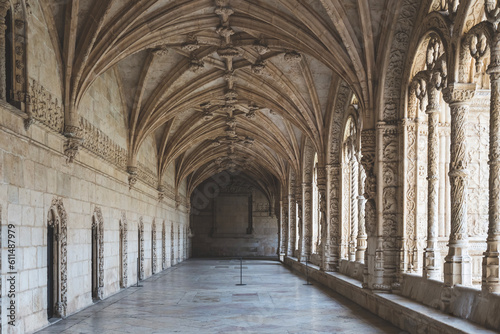 Corridor of the cloister in the Jeronimos Monastery with arched stone interior in Lisbon, Portugal