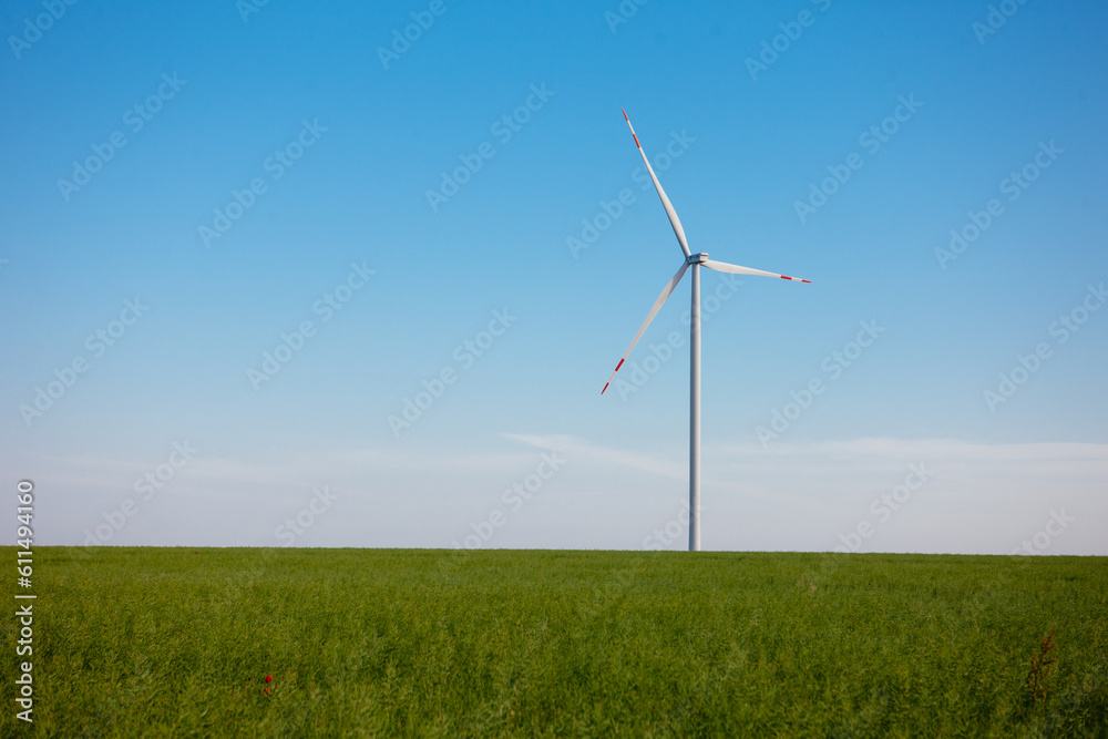 Panoramic view of wind farm or wind park, with high wind turbines for generation electricity with copy space. Green energy concept, in the world. Panoramic view of wind farm or wind park, with high wind turbines for generation electricity with copy space. Green energy concept, in the world.