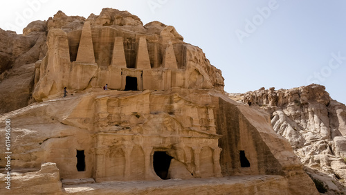 View of the Obelisk Tomb, a notable structure featuring an obelisk shape and located at the entrance caves to Al-siq in Petra, Jordan. It serves as an example of the region's architectural style.