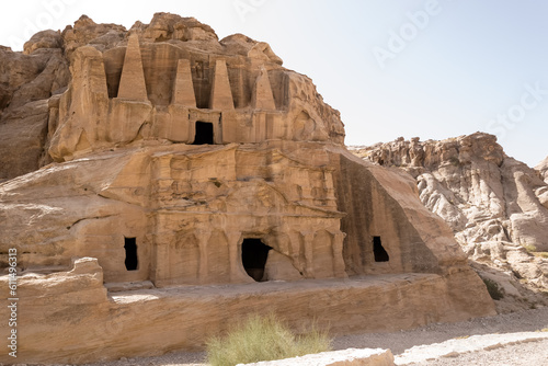 View of the Obelisk Tomb, a notable structure featuring an obelisk shape and located at the entrance caves to Al-siq in Petra, Jordan. It serves as an example of the region's architectural style.