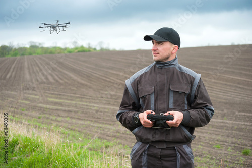 operator of an agricultural drone with a remote control, drone control for fi...