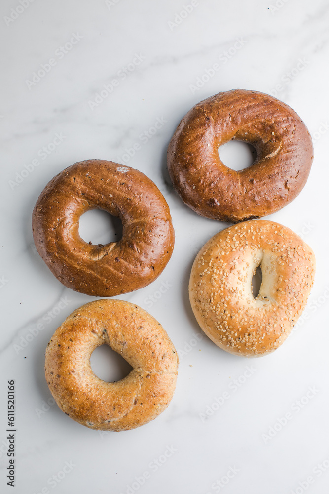 whole grain Bagels with sesame on a marble table