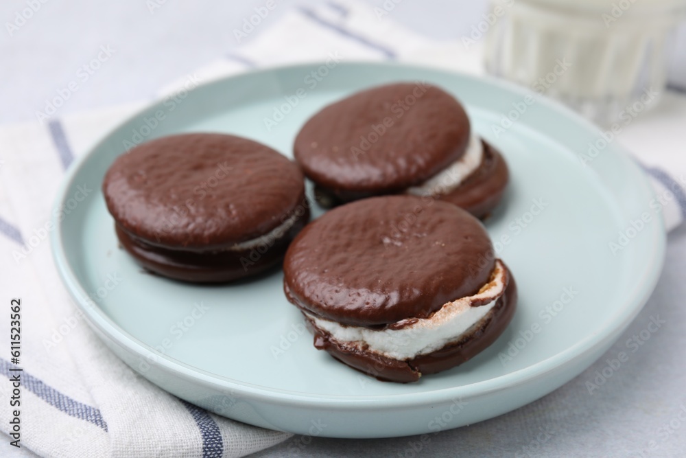 Tasty sweet choco pies on table, closeup