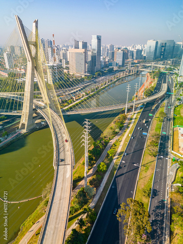 2023 view of the Pinheiros river with modern buildings beside it and the famous Octavio Frias de Oliveira bridge in the city of São Paulo. photo