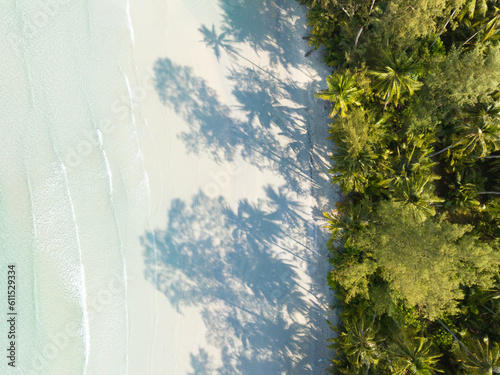 Fototapeta Naklejka Na Ścianę i Meble -  Aerial drone view of beautiful beach with turquoise sea water and palm trees of Gulf of Thailand. Kood island, Thailand.