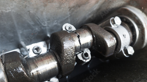 As the engine crankshaf cracks due to fatigue.