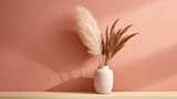 a white poster with pampas grass in a wooden vase is displayed onto a peach wall. Generative AI