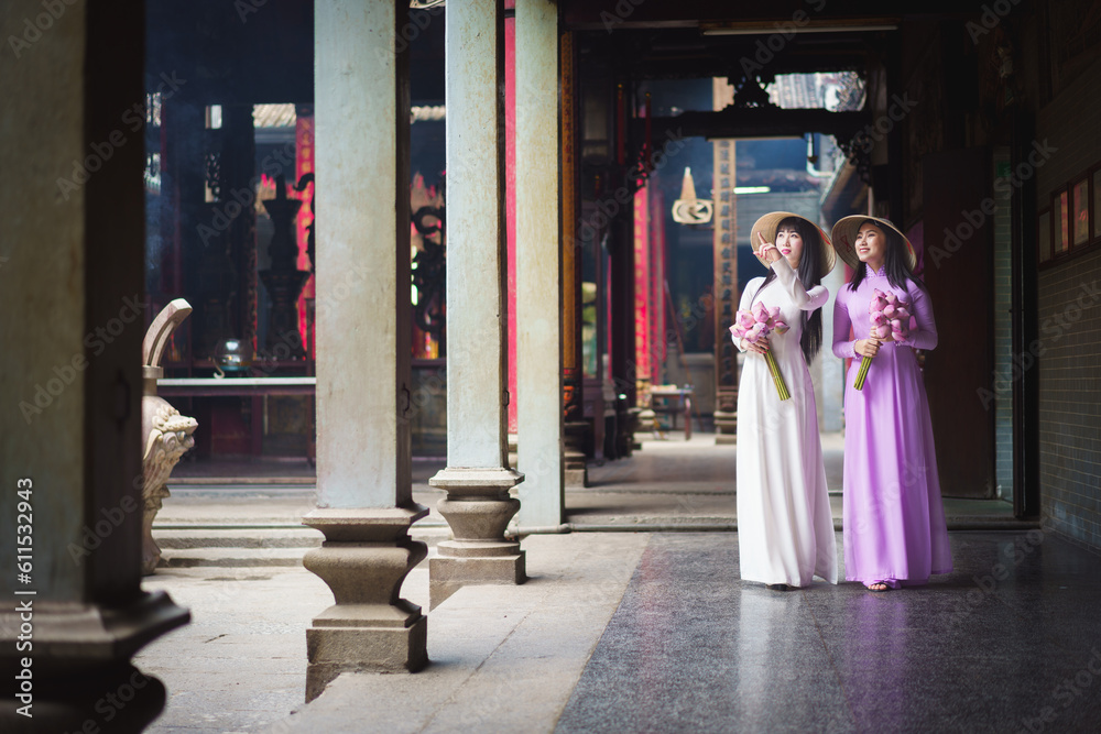 Beautiful vietnamese woman in Ao Dai white-traditional dress of vietnam, Ho Chi Minh city Vietnam