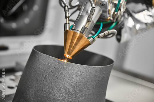 Fototapeta Naklejka Na Ścianę i Meble -  3d printer makes mechanical detail with metal powder in shop
