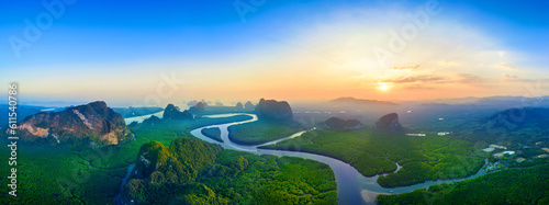 Panorama of Phang Nga bay with mountains at sunset in Thailand. photo