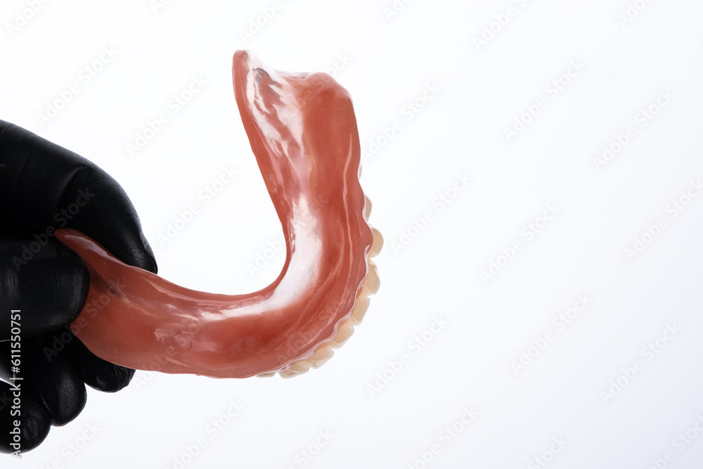Acrylic resin base of complete denture view isolated on white background. Acrylic resin base of complete denture view isolated on white background.