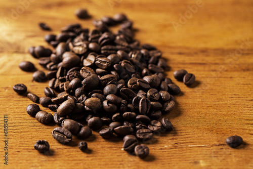 Coffee beans over wooden surface