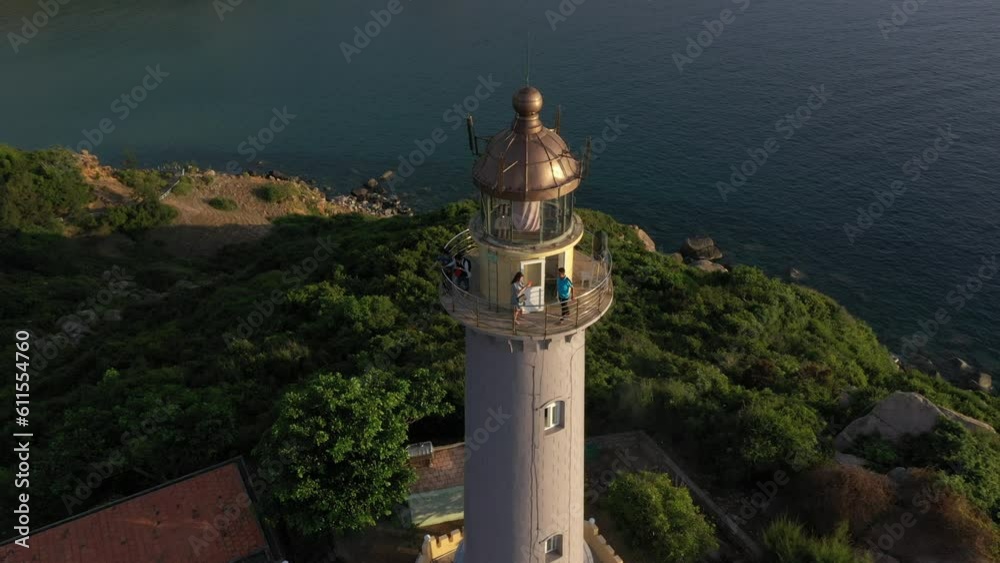 Dai Lanh Lighthouse light on the stone shore. The powerful lighthouse illuminated. Phu Yen, Vietnam Dai Lanh Lighthouse light on the stone shore. The powerful lighthouse illuminated. Phu Yen, Vietnam