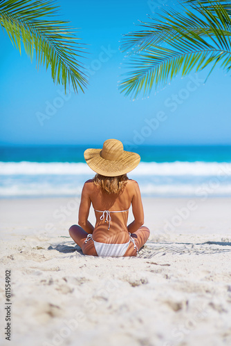 Tropical, holiday and back of woman on beach sand for adventure, summer and vacation in Mauritius. Travel mockup, ocean and female person relax in bikini by ocean for tourism, traveling and getaway
