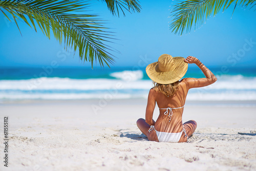 Tropical island, beach and back of woman for summer adventure, holiday and vacation in Mauritius. Travel mockup, ocean and female person relax in bikini on sand for tourism, traveling and getaway