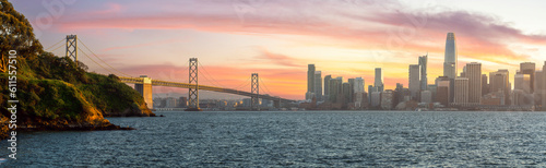 Cityscape view of San Francisco and the Bay Bridge with Colorful Sunset from island