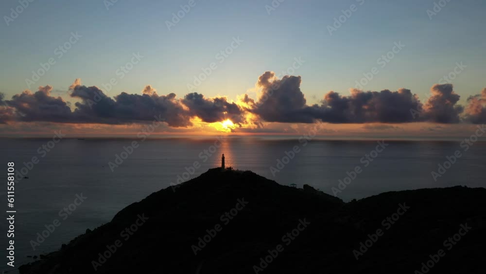 Dai Lanh Lighthouse light on the stone shore. The powerful lighthouse illuminated. Phu Yen, Vietnam Dai Lanh Lighthouse light on the stone shore. The powerful lighthouse illuminated. Phu Yen, Vietnam