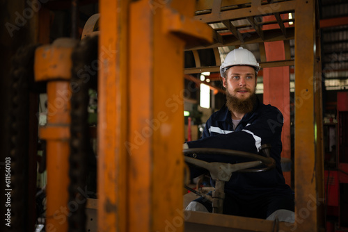 Engineer checks the operation of the forklift truck after the repair is completed.