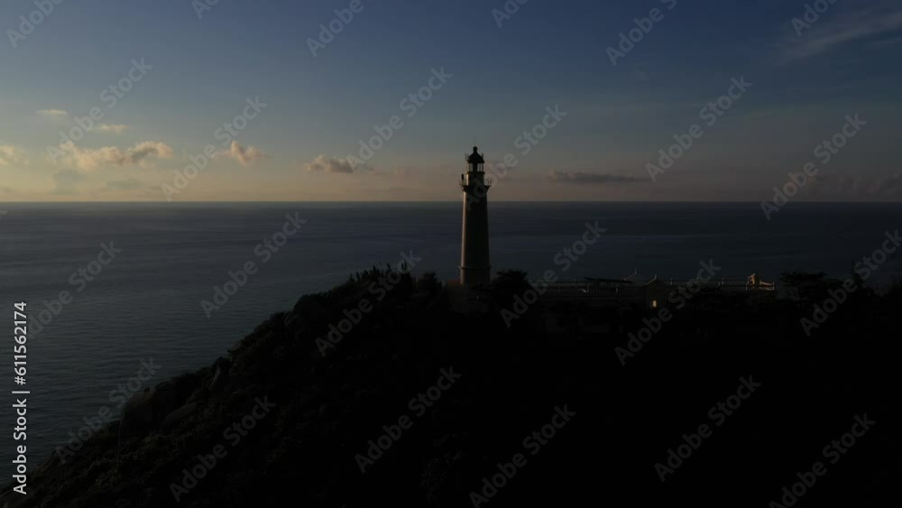 Dai Lanh Lighthouse light on the stone shore. The powerful lighthouse illuminated. Phu Yen, Vietnam Dai Lanh Lighthouse light on the stone shore. The powerful lighthouse illuminated. Phu Yen, Vietnam